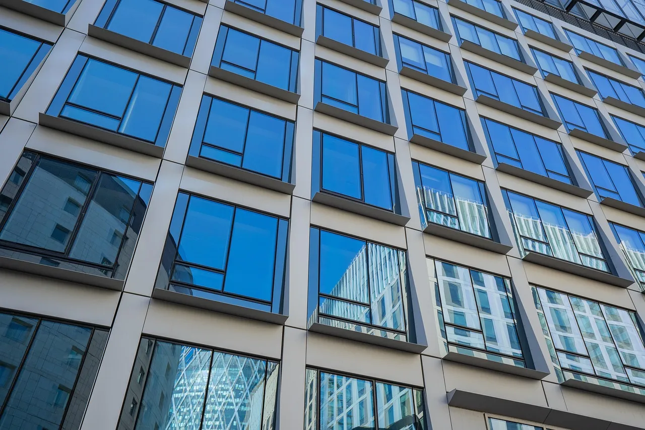 Professional painting crew working on a commercial building exterior in Minnesota