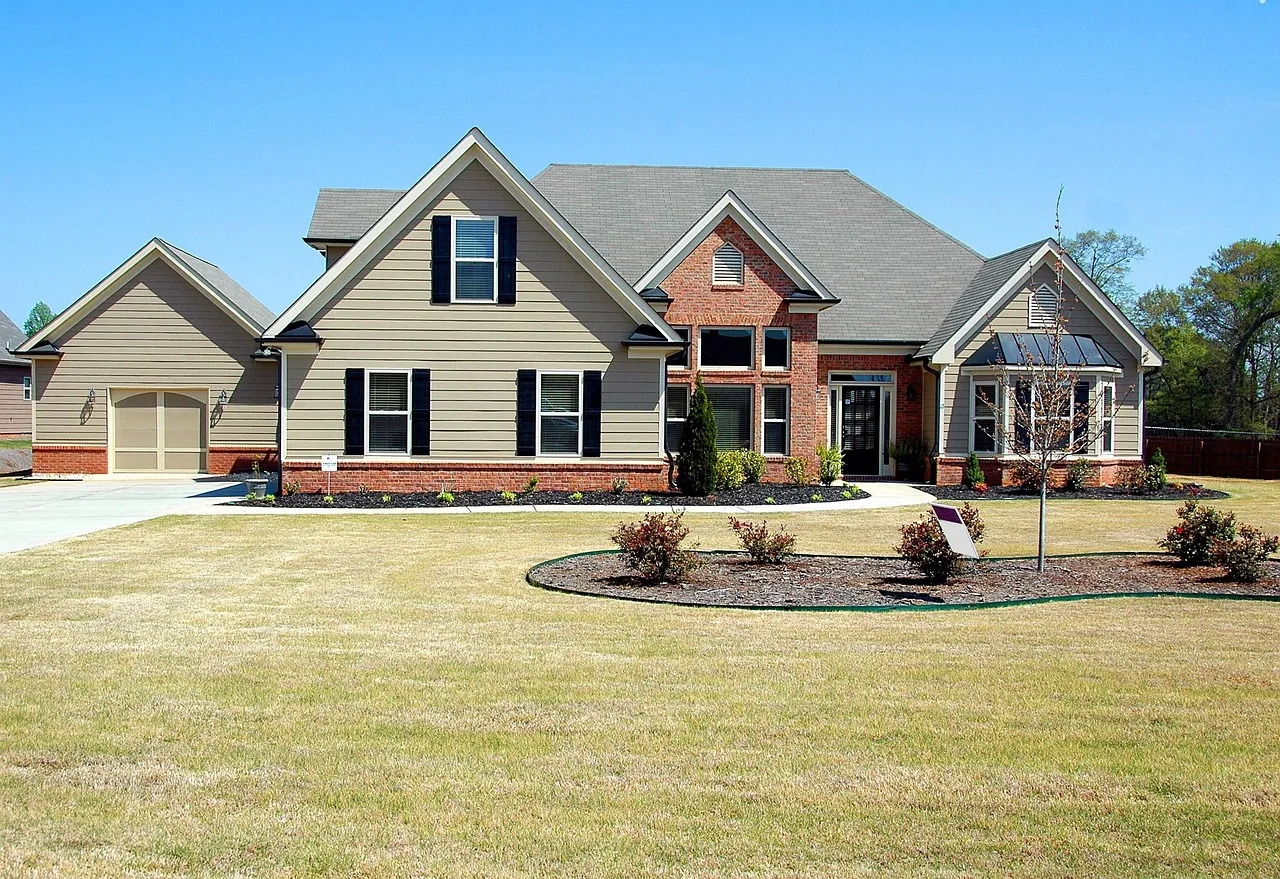 Beautifully maintained home exterior staged for sale with fresh paint and clean landscaping