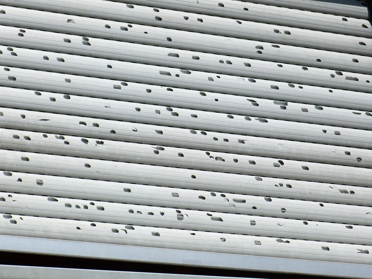 Close-up of impact-resistant Class 4 asphalt shingles installed on a Minnesota residential roof