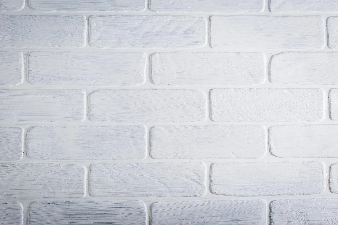 Comparison of faded exterior paint on south-facing wall versus vibrant paint on shaded north-facing wall