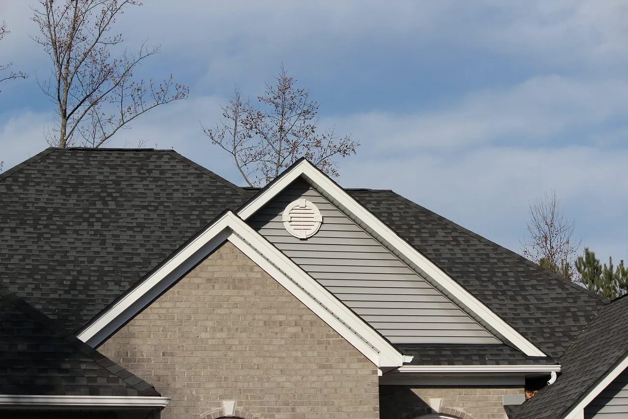 Roof ridge vent installation on Minnesota home showing proper attic ventilation system