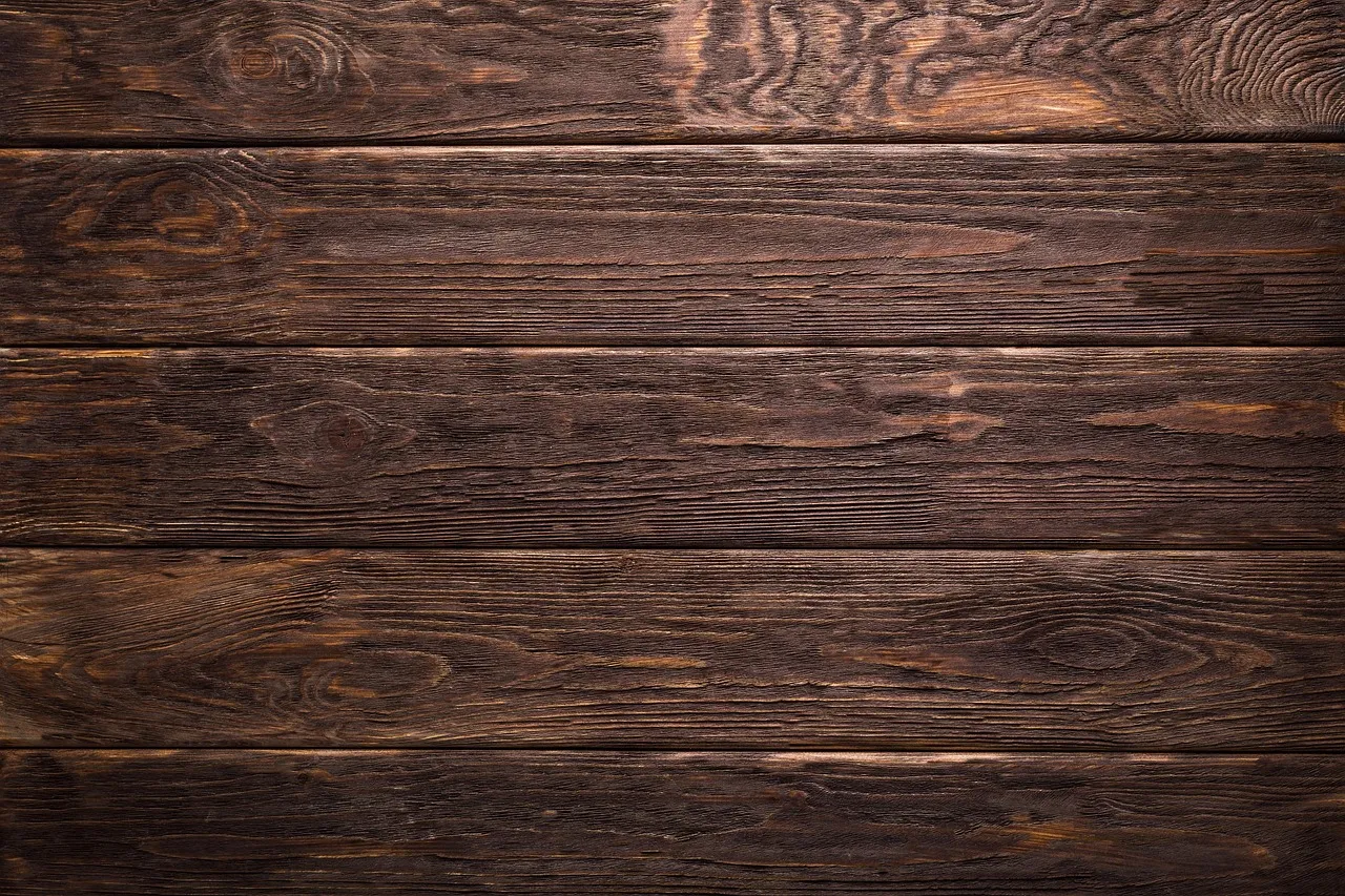 Side-by-side comparison of TimberTech and Trex composite decking board samples showing color and texture differences