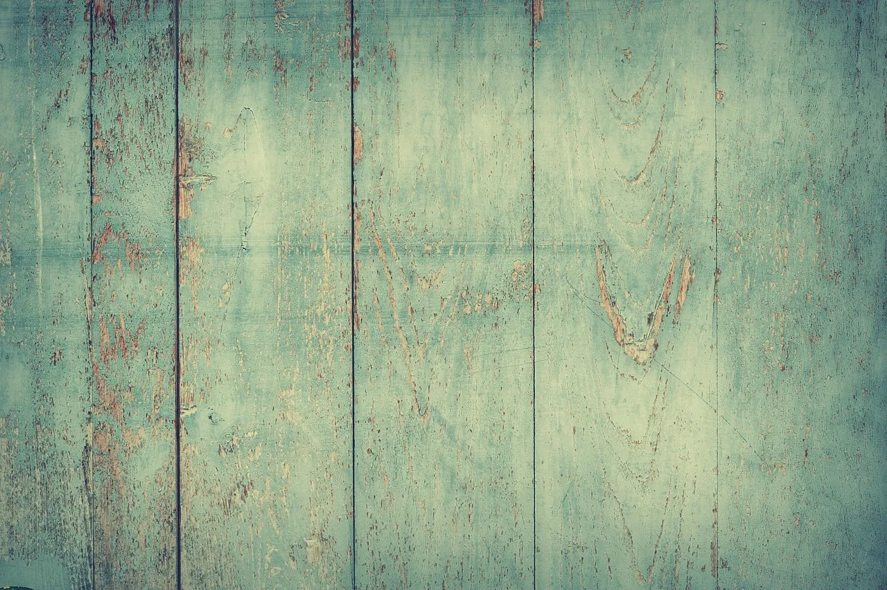 Aging wood deck in Minnesota showing visible signs of rot, cracking, and weathering damage
