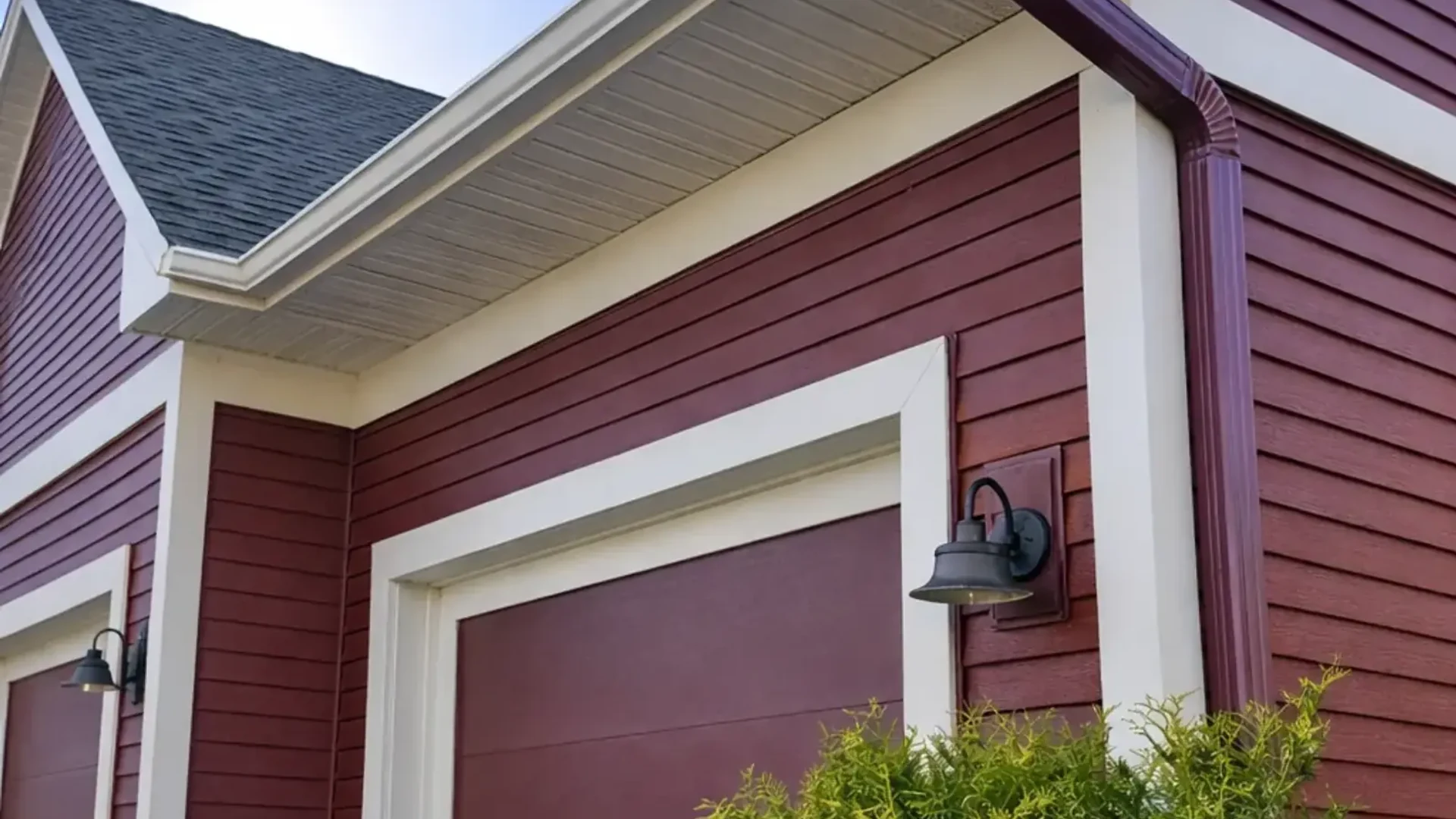 completed siding gutters red lap white trim