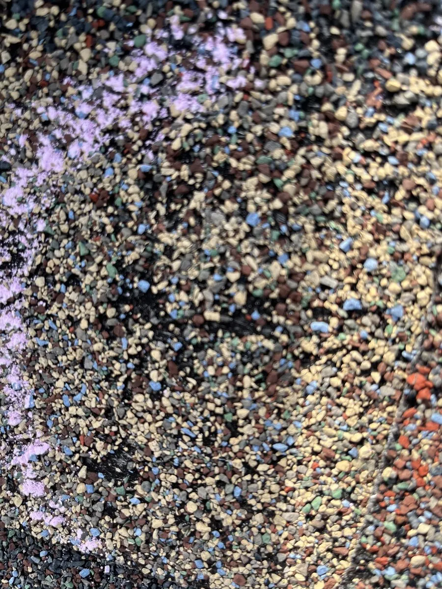 Close-up of shingle granule loss damage pattern