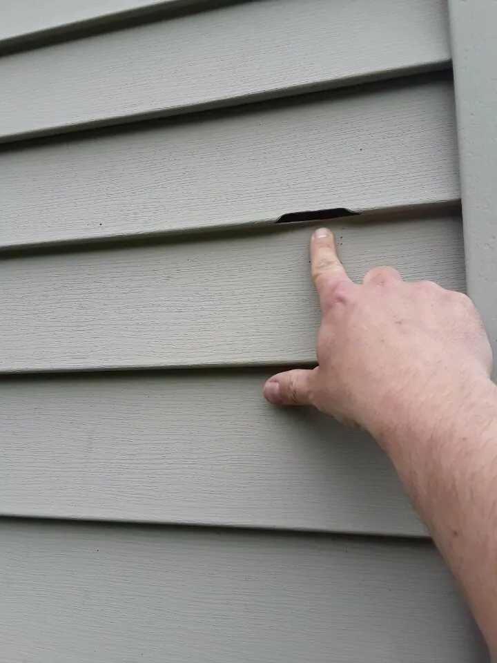 Storm damage to siding requiring professional repair